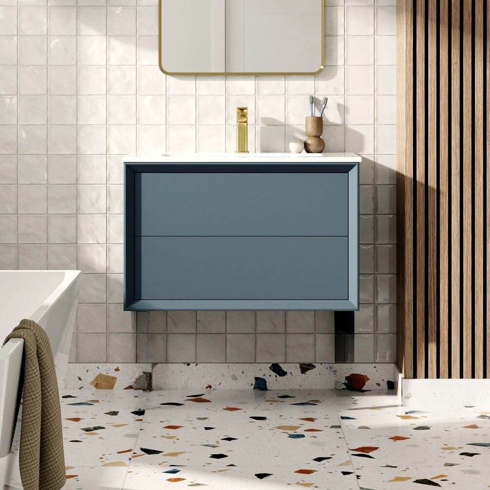 Product lifestyle image of Apex Air Matt Cotton 815mm Wall Hung Vanity Unit and Basin against tiled wall with terrazzo flooring ZERO108466